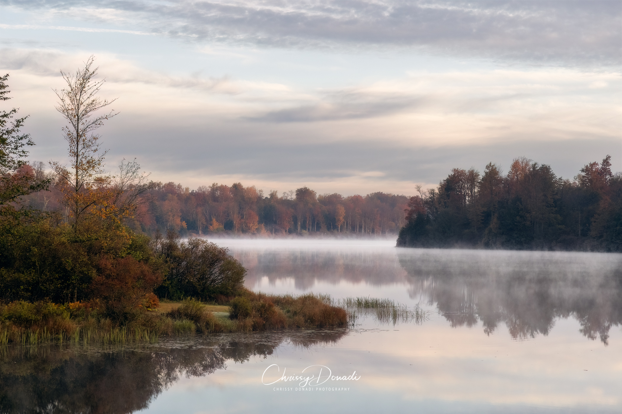 Quite Morning on the Lake in Autumn with Mist on the water in Appalachian mountains of Pennsylvania